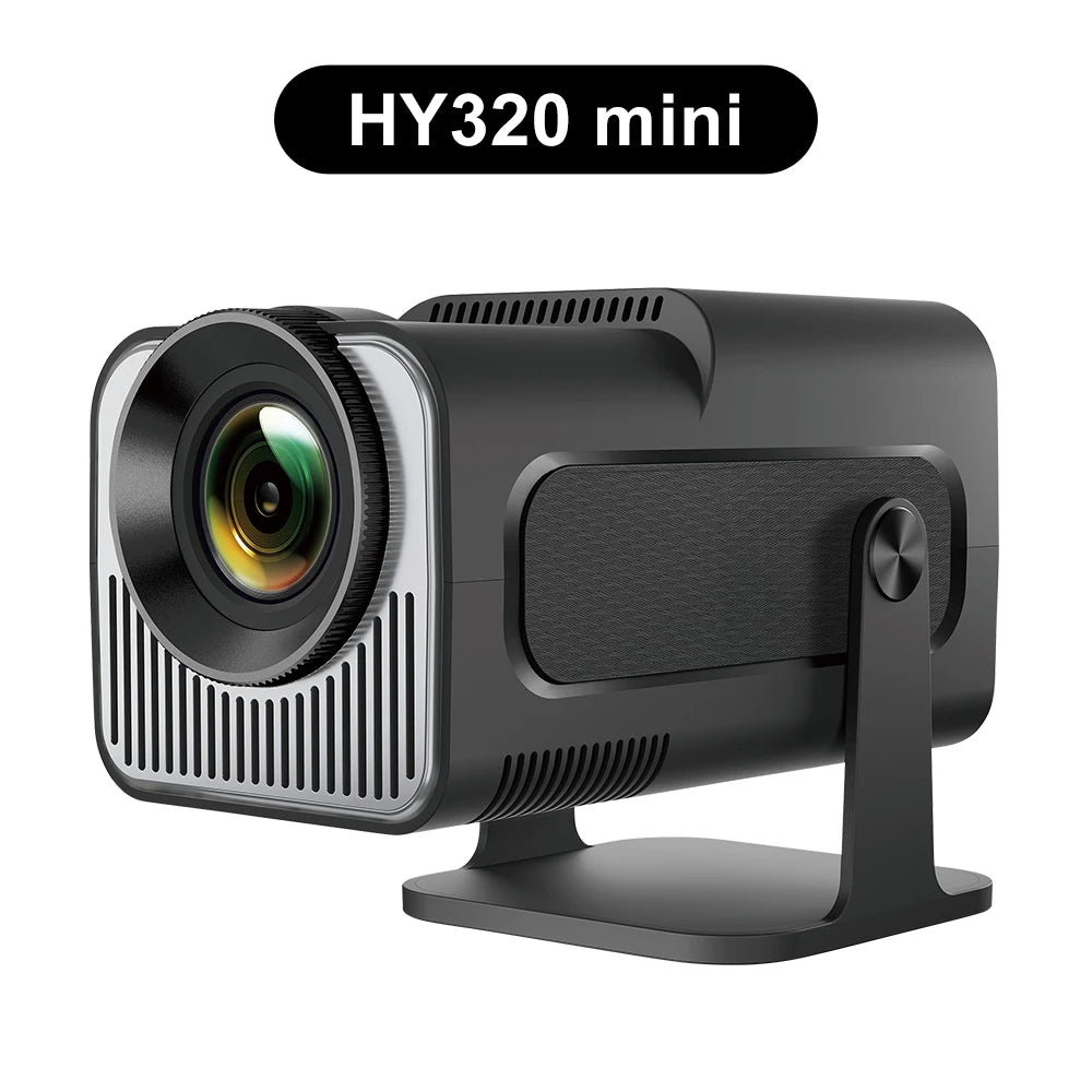 HY320 mini portable projector with sleek black and silver design. Features a modern lens and compact form factor, ideal for home entertainment or presentations. The projector is mounted on a sturdy black stand, and the brand name 'HY320 mini' is displayed above it. The overall design emphasizes portability and high-tech functionality.